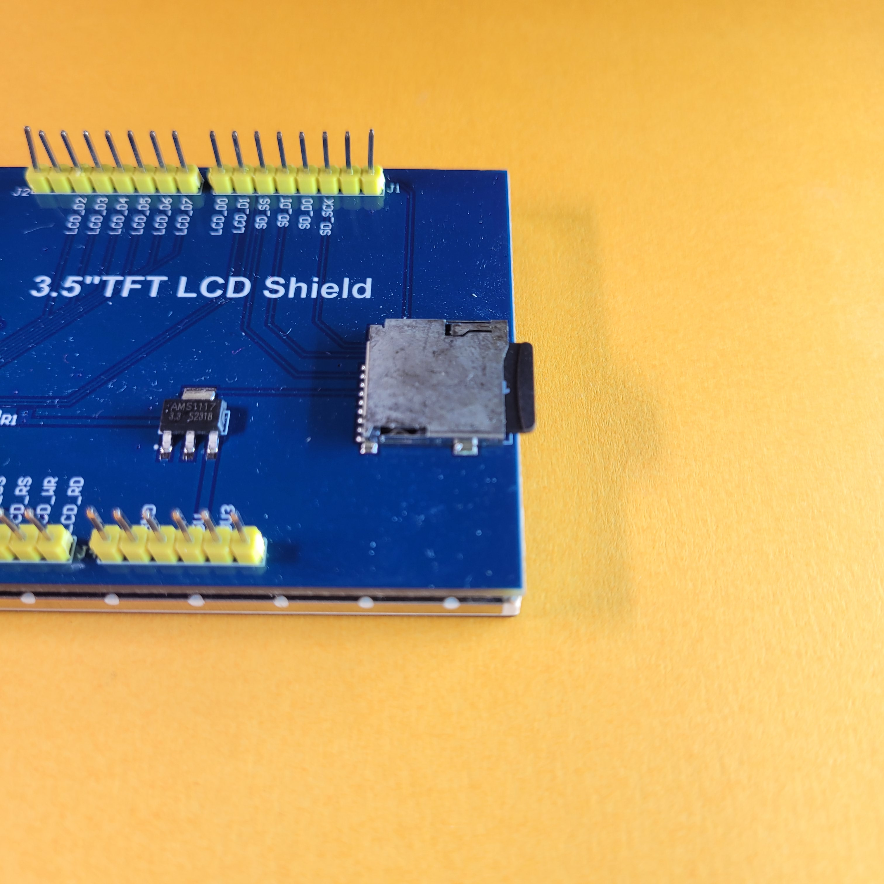Image of a micro-sd card inserted into the SD Card slot on the back of the ILI9486 TFT LCD Shield